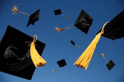 photo of graduation caps tossed in air